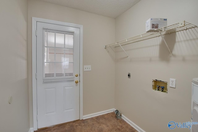 laundry area with a textured ceiling, laundry area, washer hookup, carpet flooring, and baseboards