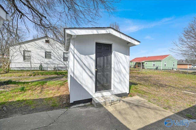 view of shed with fence