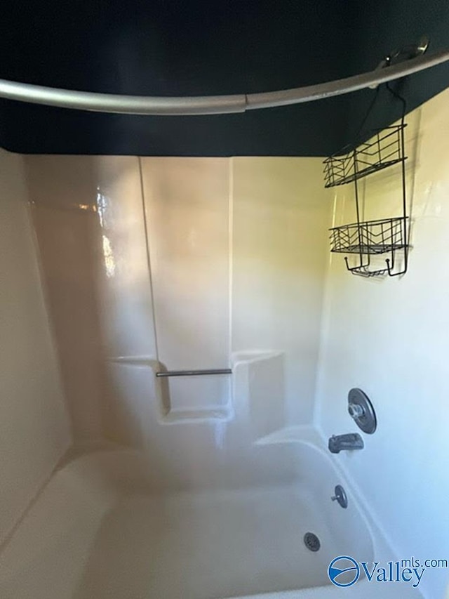 bathroom with shower / bath combination