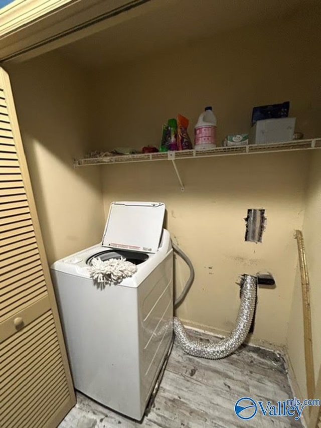 washroom with washer / clothes dryer