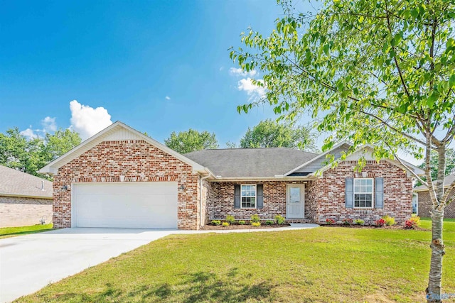19048 Racheals Loop, Athens, AL 35611 - single story home with concrete driveway, a front yard, brick siding, and a garage
