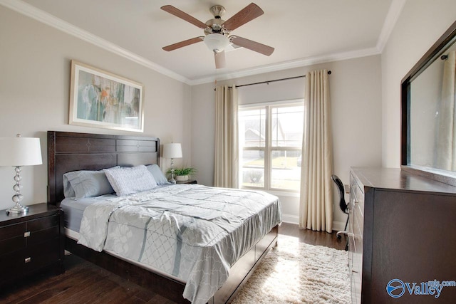 bedroom featuring dark wood-type flooring, crown molding, and ceiling fan