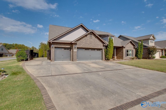 view of front of house with a front lawn and a garage