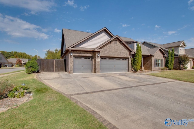 view of front of home featuring a garage and a front lawn