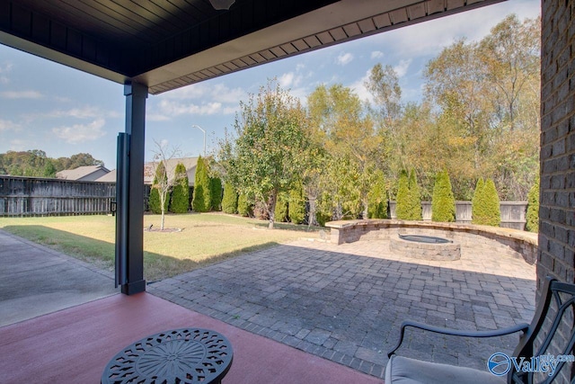 view of patio / terrace featuring an outdoor fire pit