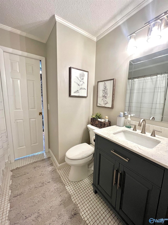 bathroom featuring ornamental molding, vanity, toilet, and a textured ceiling