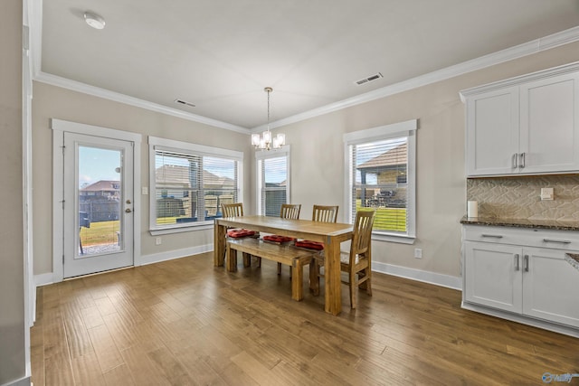 22584 Big Oak Dr, Athens, AL 35613 - dining area featuring visible vents, dark wood-style floors, a wealth of natural light, and an inviting chandelier