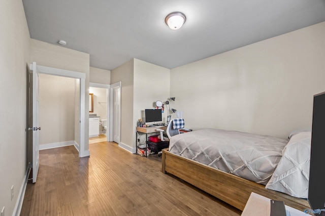 22584 Big Oak Dr, Athens, AL 35613 - bedroom featuring wood finished floors, baseboards, and connected bathroom