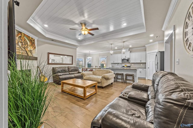 22584 Big Oak Dr, Athens, AL 35613 - living area with a ceiling fan, crown molding, light wood-type flooring, a raised ceiling, and recessed lighting