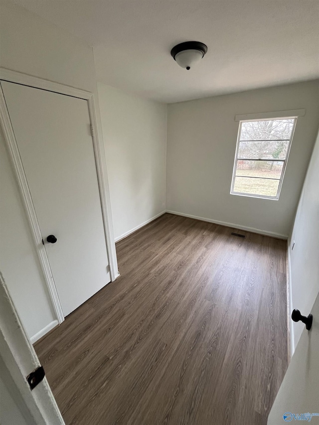 empty room featuring dark hardwood / wood-style floors