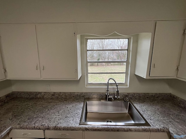 kitchen with sink and white cabinets