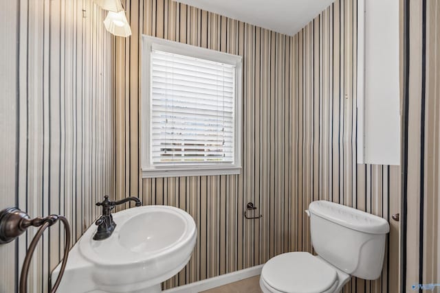 bathroom featuring toilet and sink