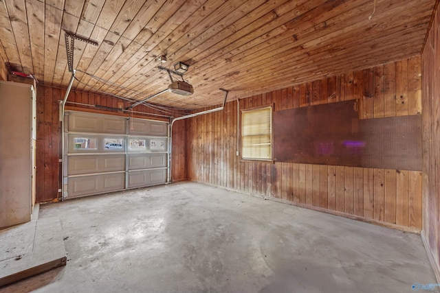 garage featuring wood walls, wooden ceiling, and a garage door opener