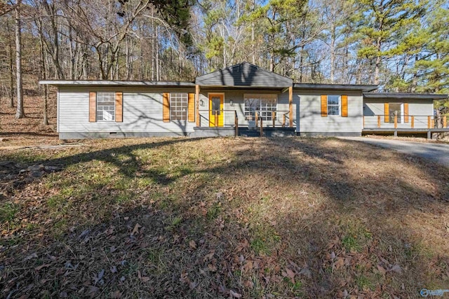 single story home featuring a front lawn and covered porch