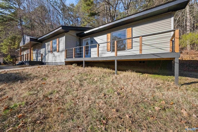 view of side of home featuring a deck