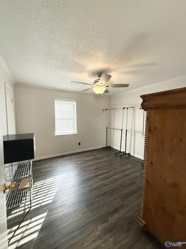 unfurnished living room with a textured ceiling, dark hardwood / wood-style floors, ceiling fan, and crown molding