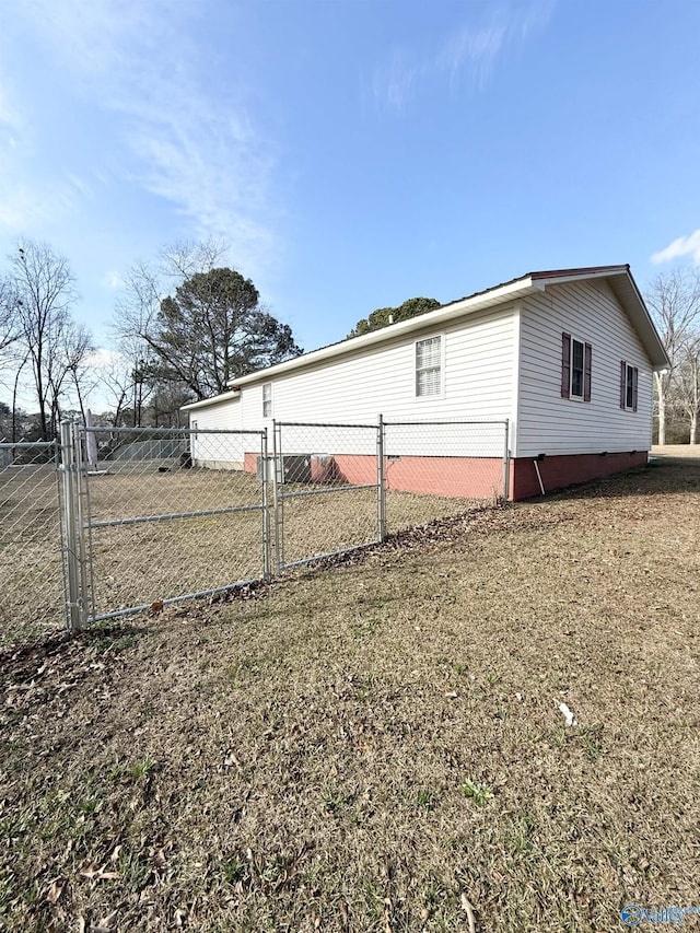 view of property exterior with a lawn