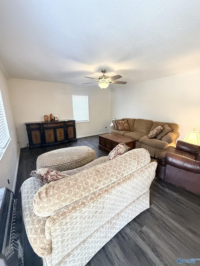 living room with a textured ceiling, dark hardwood / wood-style floors, and ceiling fan