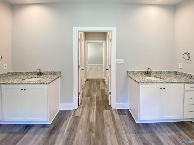 laundry room with sink and dark hardwood / wood-style flooring