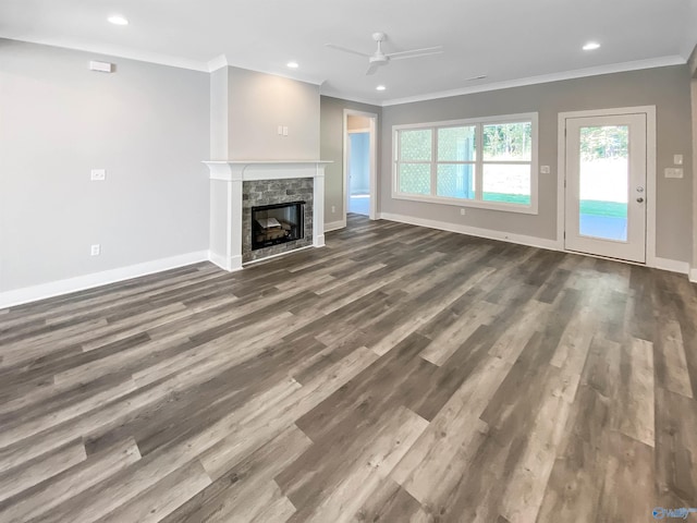 unfurnished living room with a fireplace, crown molding, hardwood / wood-style flooring, and ceiling fan