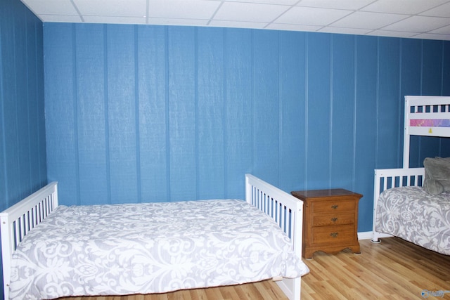 bedroom with wood-type flooring