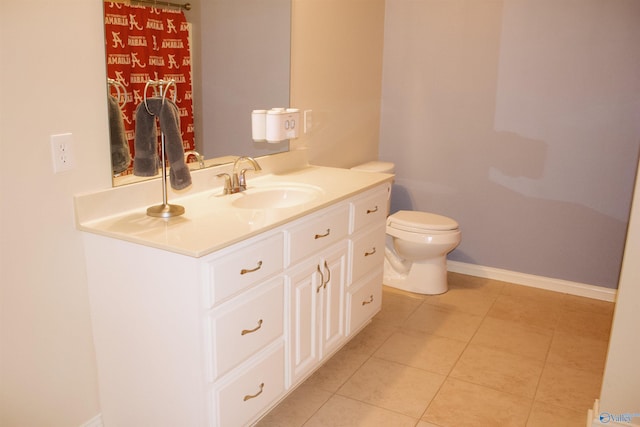 bathroom featuring tile patterned floors, toilet, and vanity