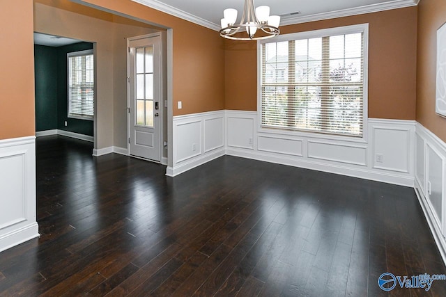 unfurnished dining area featuring dark hardwood / wood-style flooring, a chandelier, and ornamental molding