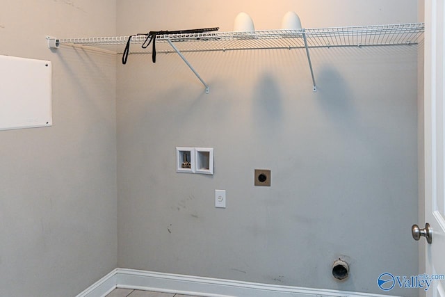 clothes washing area with gas dryer hookup, washer hookup, and hookup for an electric dryer