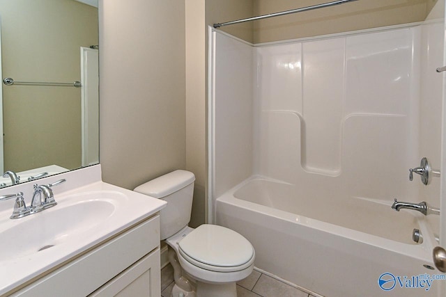 full bathroom with tile patterned flooring, bathtub / shower combination, vanity, and toilet