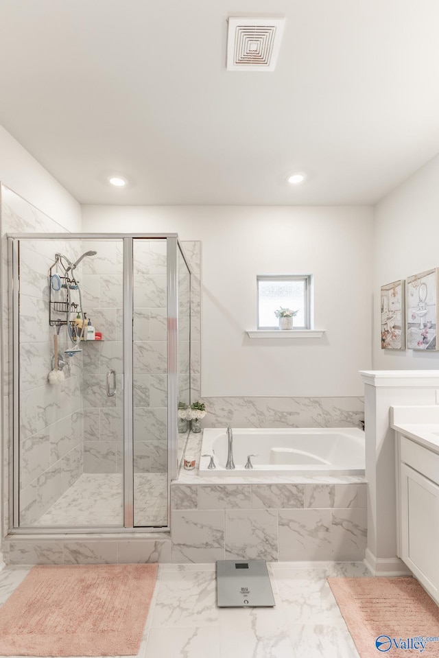 bathroom with a bath, a stall shower, visible vents, marble finish floor, and vanity