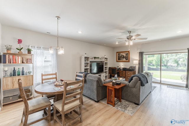 dining space with a ceiling fan, light wood finished floors, and recessed lighting