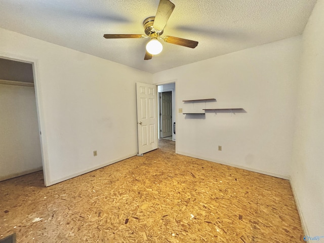 unfurnished bedroom with ceiling fan, a closet, and a textured ceiling