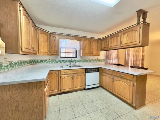 kitchen with kitchen peninsula, a textured ceiling, and sink