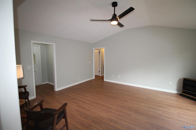 195 Holly Lynn Ln, Hazel Green, AL 35750 - unfurnished living room featuring a ceiling fan, vaulted ceiling, dark wood-style flooring, and baseboards