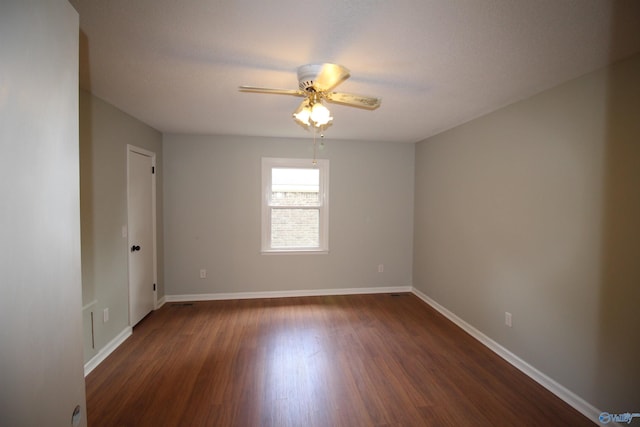 195 Holly Lynn Ln, Hazel Green, AL 35750 - spare room featuring ceiling fan, dark wood-style flooring, and baseboards