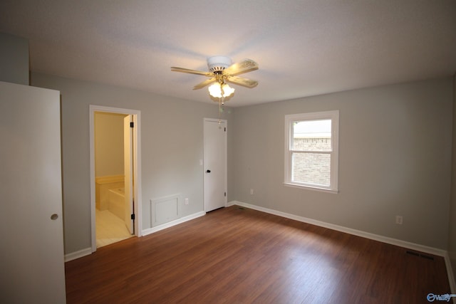 195 Holly Lynn Ln, Hazel Green, AL 35750 - unfurnished bedroom with wood finished floors, baseboards, ensuite bathroom, and ceiling fan