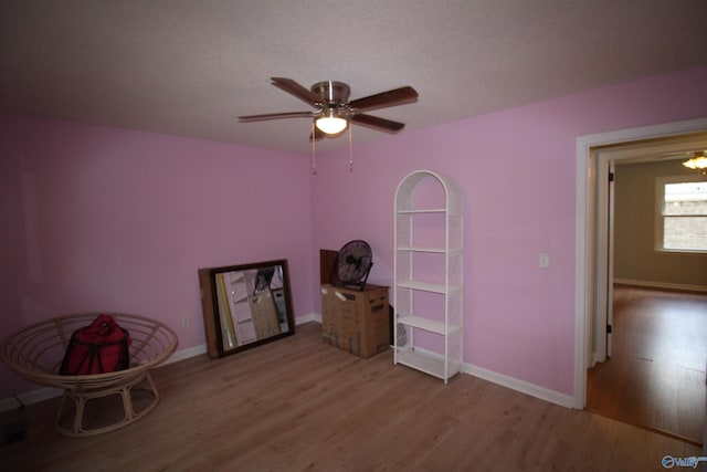 195 Holly Lynn Ln, Hazel Green, AL 35750 - living area featuring wood finished floors, ceiling fan, and baseboards