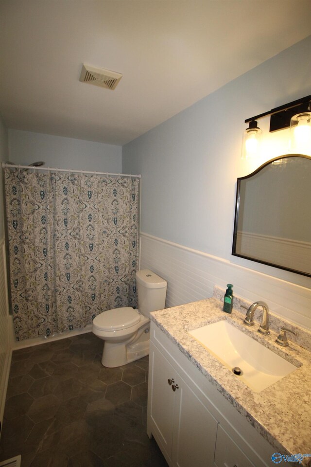 195 Holly Lynn Ln, Hazel Green, AL 35750 - bathroom with vanity, toilet, wainscoting, and a shower with curtain