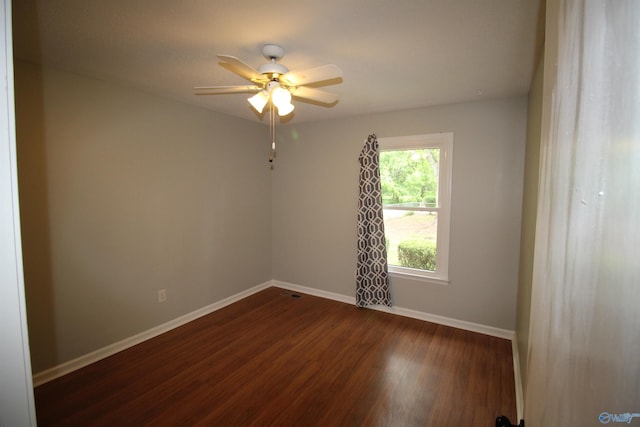 195 Holly Lynn Ln, Hazel Green, AL 35750 - spare room featuring baseboards, dark wood-type flooring, and ceiling fan