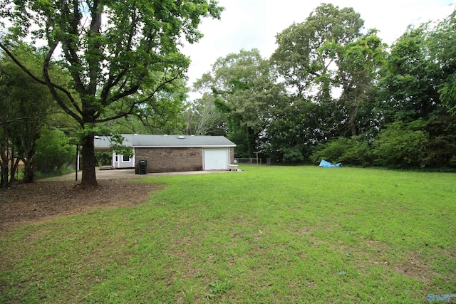195 Holly Lynn Ln, Hazel Green, AL 35750 - view of green lawn featuring a garage