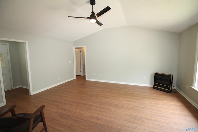 195 Holly Lynn Ln, Hazel Green, AL 35750 - unfurnished living room with a ceiling fan, heating unit, vaulted ceiling, wood finished floors, and baseboards