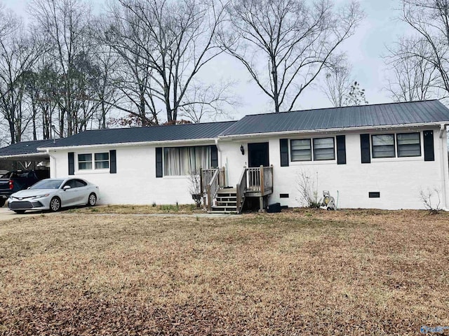 single story home featuring a front yard and a carport