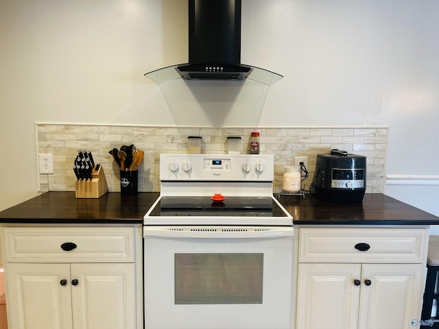 kitchen featuring extractor fan, decorative backsplash, white electric stove, and white cabinets