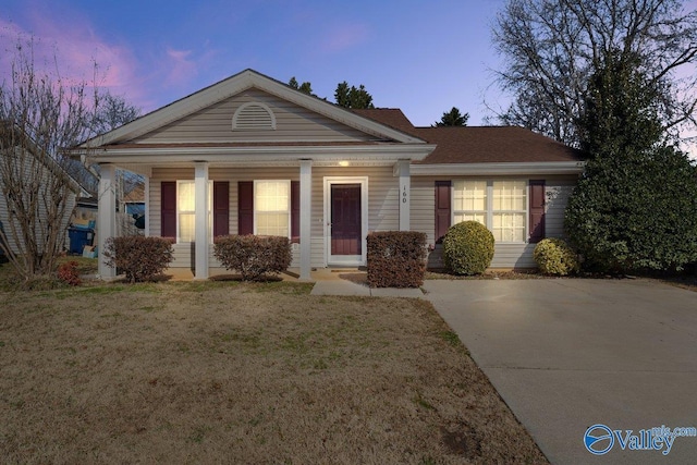 view of front of home with a lawn