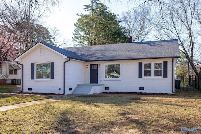 single story home with crawl space, a shingled roof, a front yard, and fence