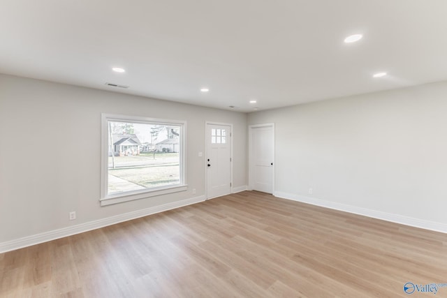 interior space with recessed lighting, baseboards, and light wood-style floors