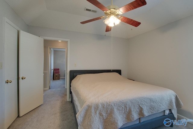 bedroom with a ceiling fan, light colored carpet, and visible vents