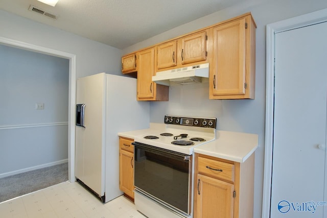 kitchen featuring under cabinet range hood, light brown cabinets, visible vents, and white appliances