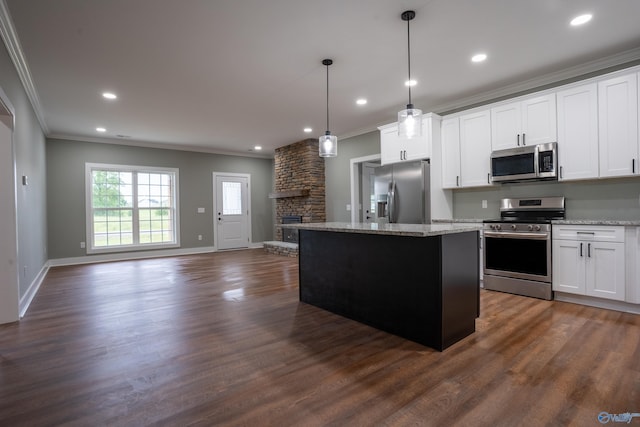 55 Edgewood St, Rainsville, AL 35986 - kitchen featuring appliances with stainless steel finishes, crown molding, open floor plan, a center island, and recessed lighting