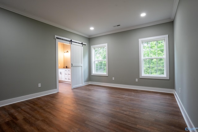 55 Edgewood St, Rainsville, AL 35986 - unfurnished bedroom with a barn door, multiple windows, ornamental molding, baseboards, and dark wood finished floors